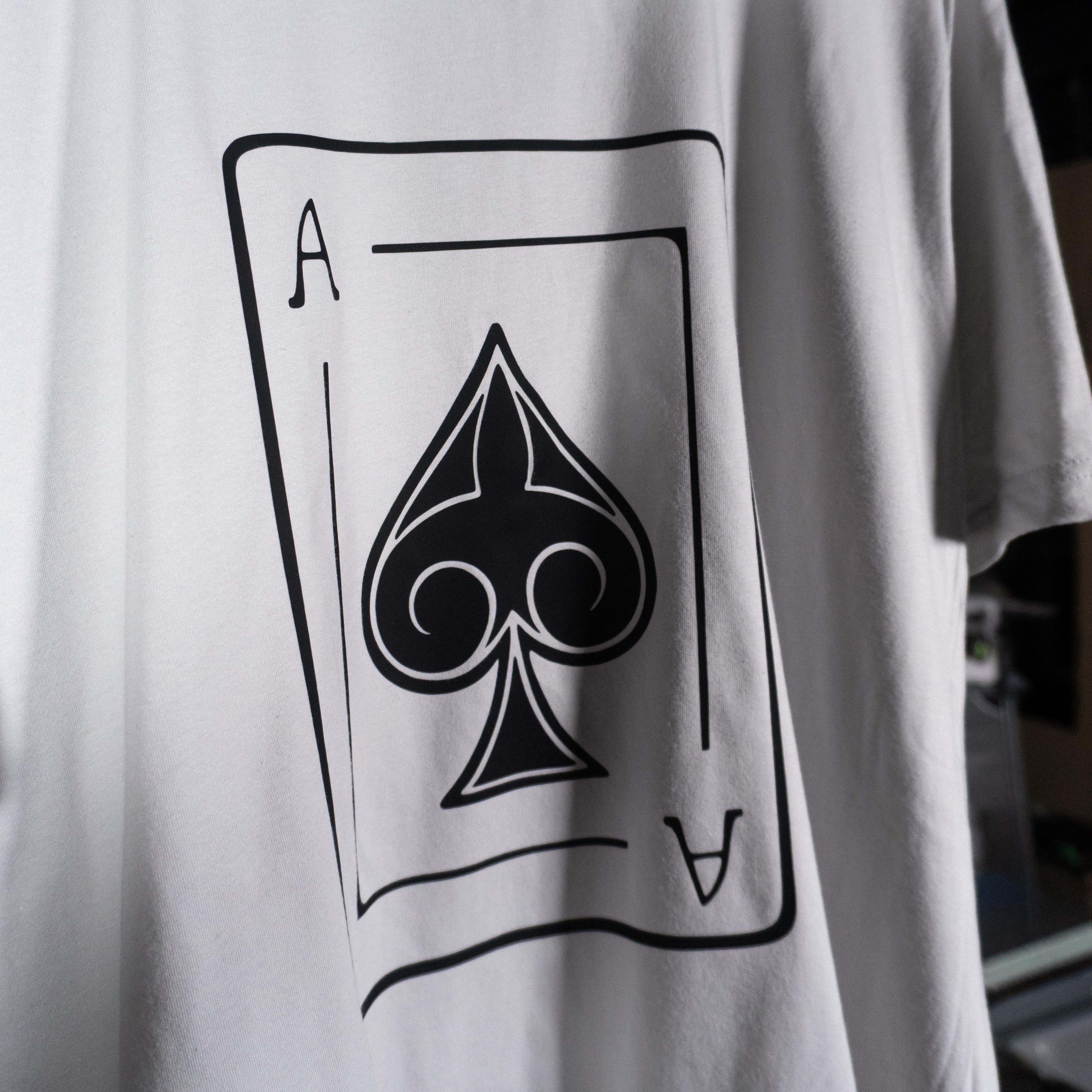 Ace of Spades playing card original hand drawn design by Anthony Lachus on a light gray colored premium t-shirt