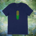 A navy blue short-sleeve t-shirt with a central graphic of a green and yellow corn cob, displayed against a blurred green foliage background.
