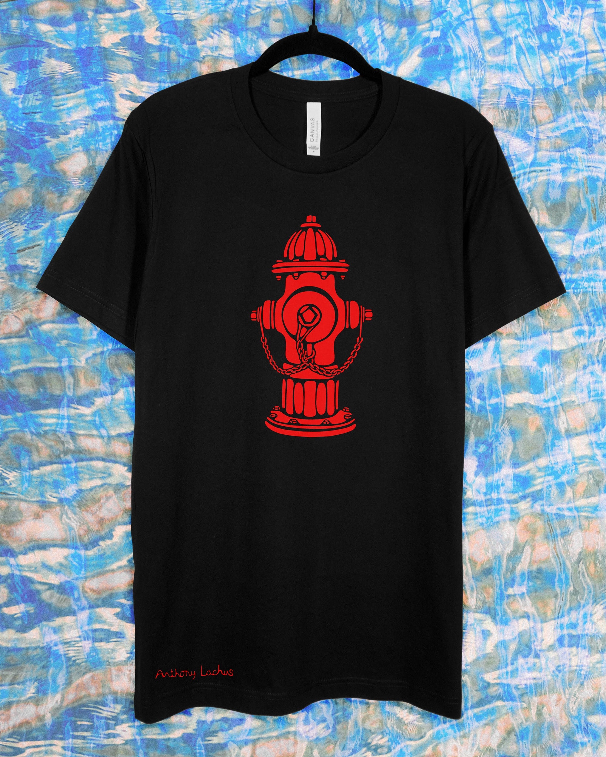 Black t-shirt with a red fire hydrant design on a blue and white patterned background