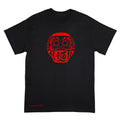 A black short-sleeve t-shirt with a red Daruma doll graphic on the chest and 'Anthony Lachus' printed in red near the bottom left, displayed on a solid white background.