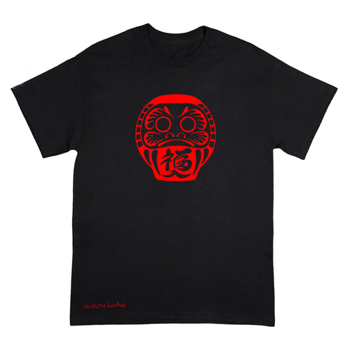 A black short-sleeve t-shirt with a red Daruma doll graphic on the chest and 'Anthony Lachus' printed in red near the bottom left, displayed on a solid white background.