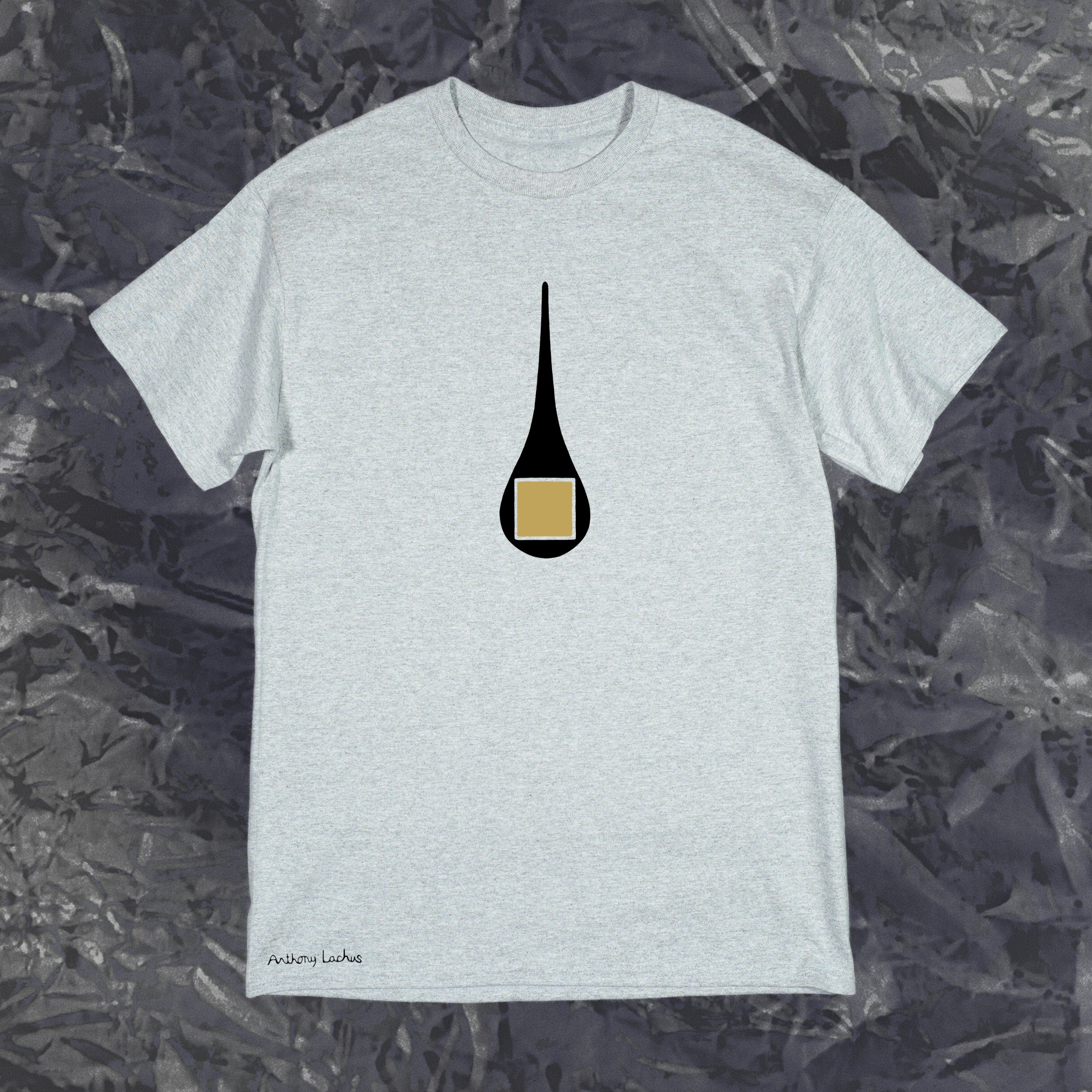 Gray t-shirt with a black and gold graphic on a textured dark background