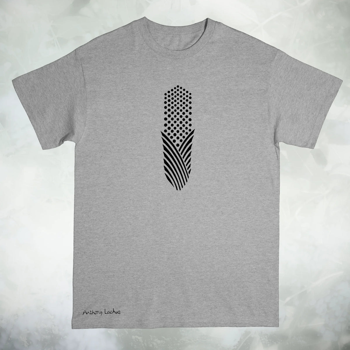 A gray short sleeved Gildan g500 crew neck t-shirt featuring a graphic design of a black piece of abstract corn, laid flat on a textured white background. Original hand drawn artwork by Anthony Lachus. Signature on the lower left. Front view.