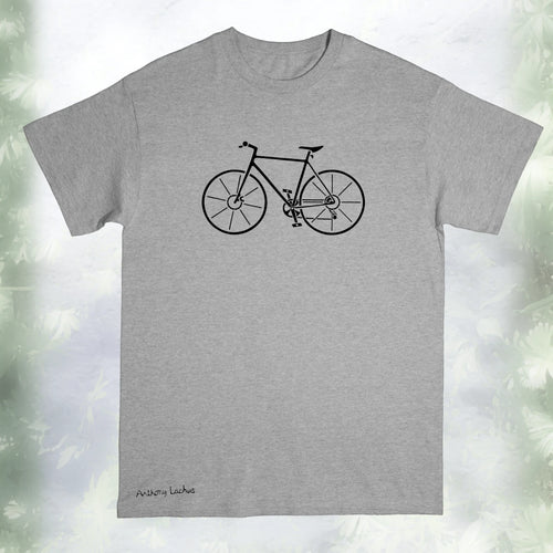 A gray Gildan g500 crewneck t-shirt featuring a graphic design of a black bicycle, laid flat on a white and green background. An original, hand drawn design by Anthony Lachus with the artists signature on the lower left. Front view.