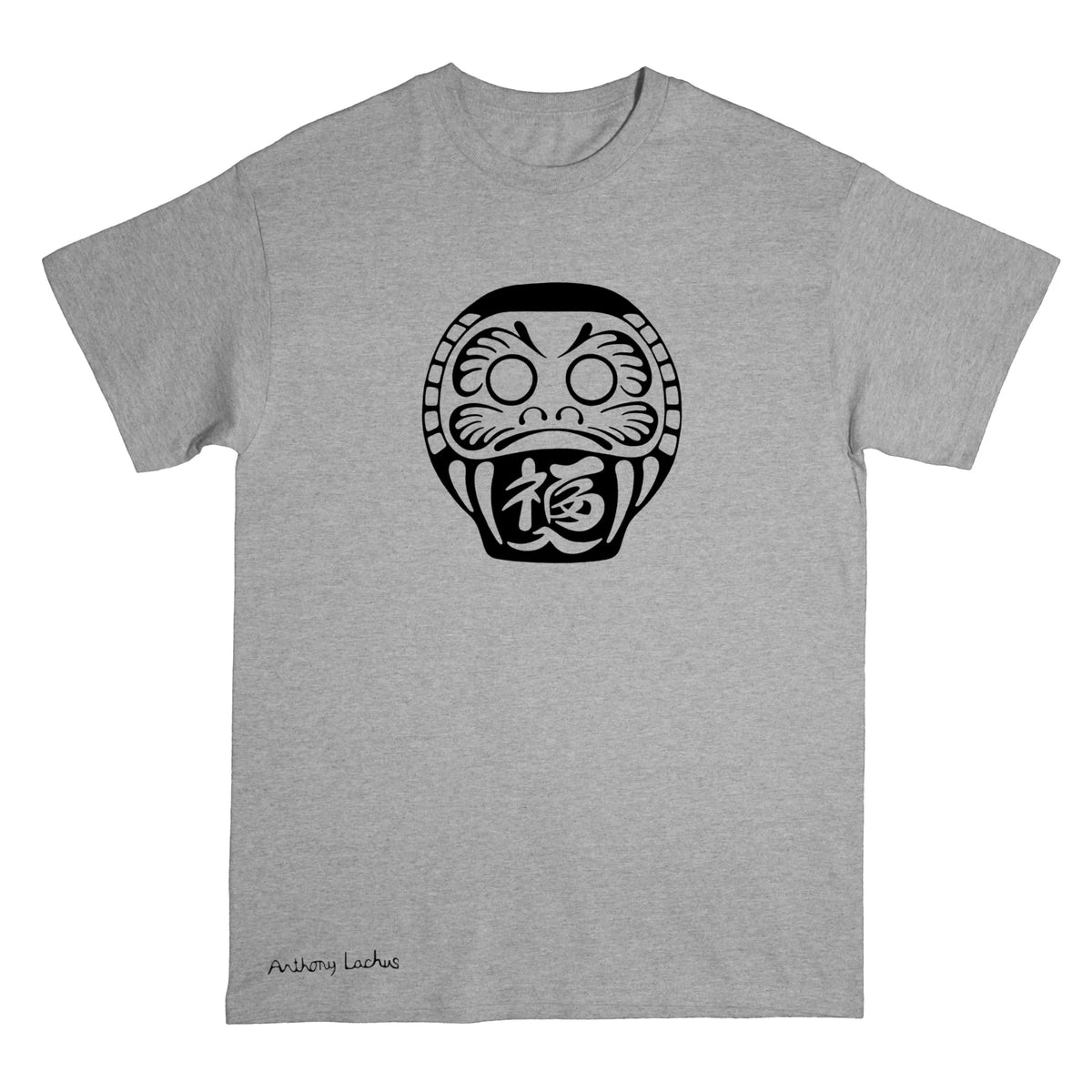 A heather gray short-sleeve t-shirt with a black Daruma doll graphic printed on the chest and a small 'Anthony Lachus' signature near the bottom left hem, shown against a plain white background.