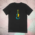 Black t-shirt with a colorful guitar graphic on a geometric patterned background