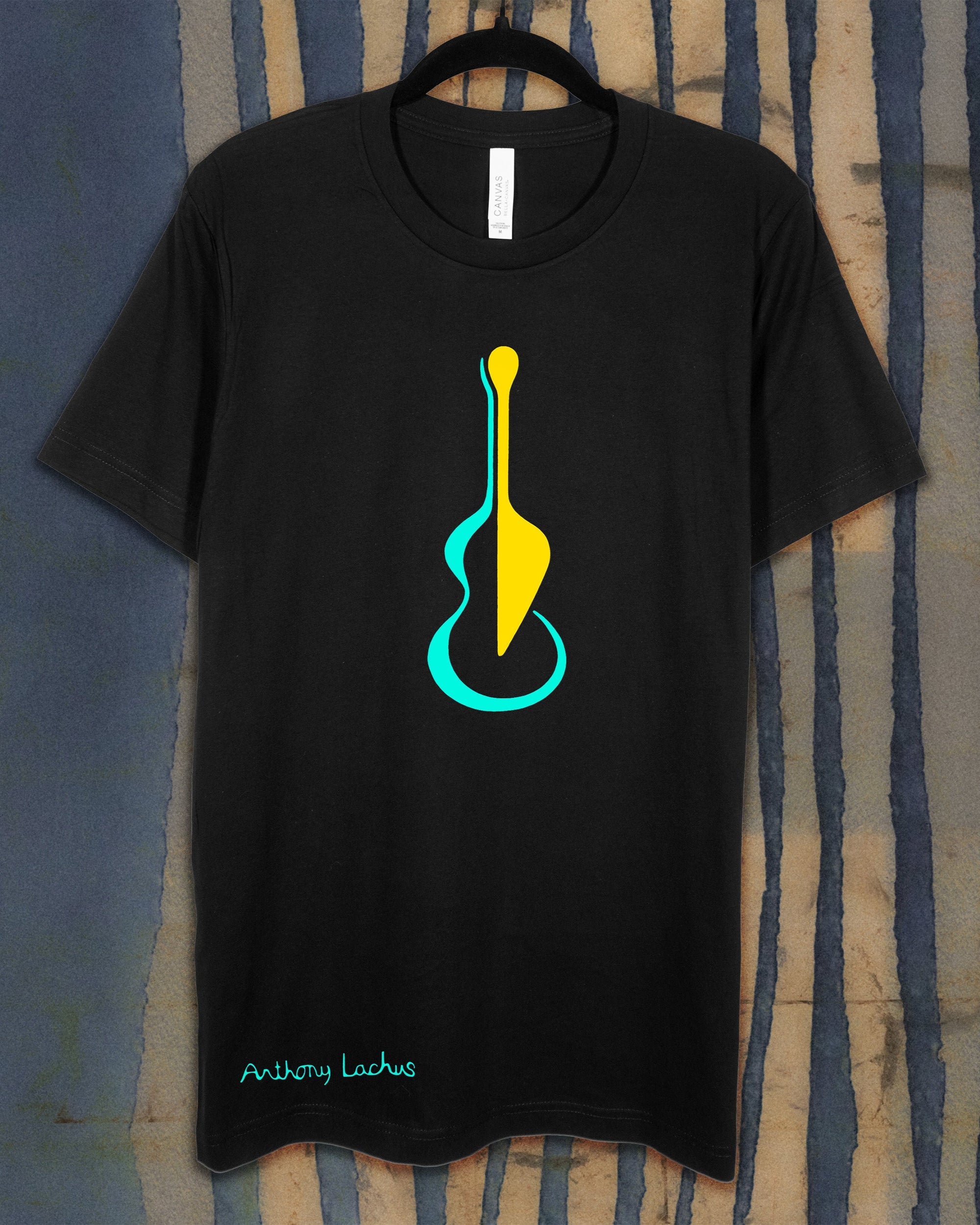 black shirt with image of a guitar in blue and yellow
