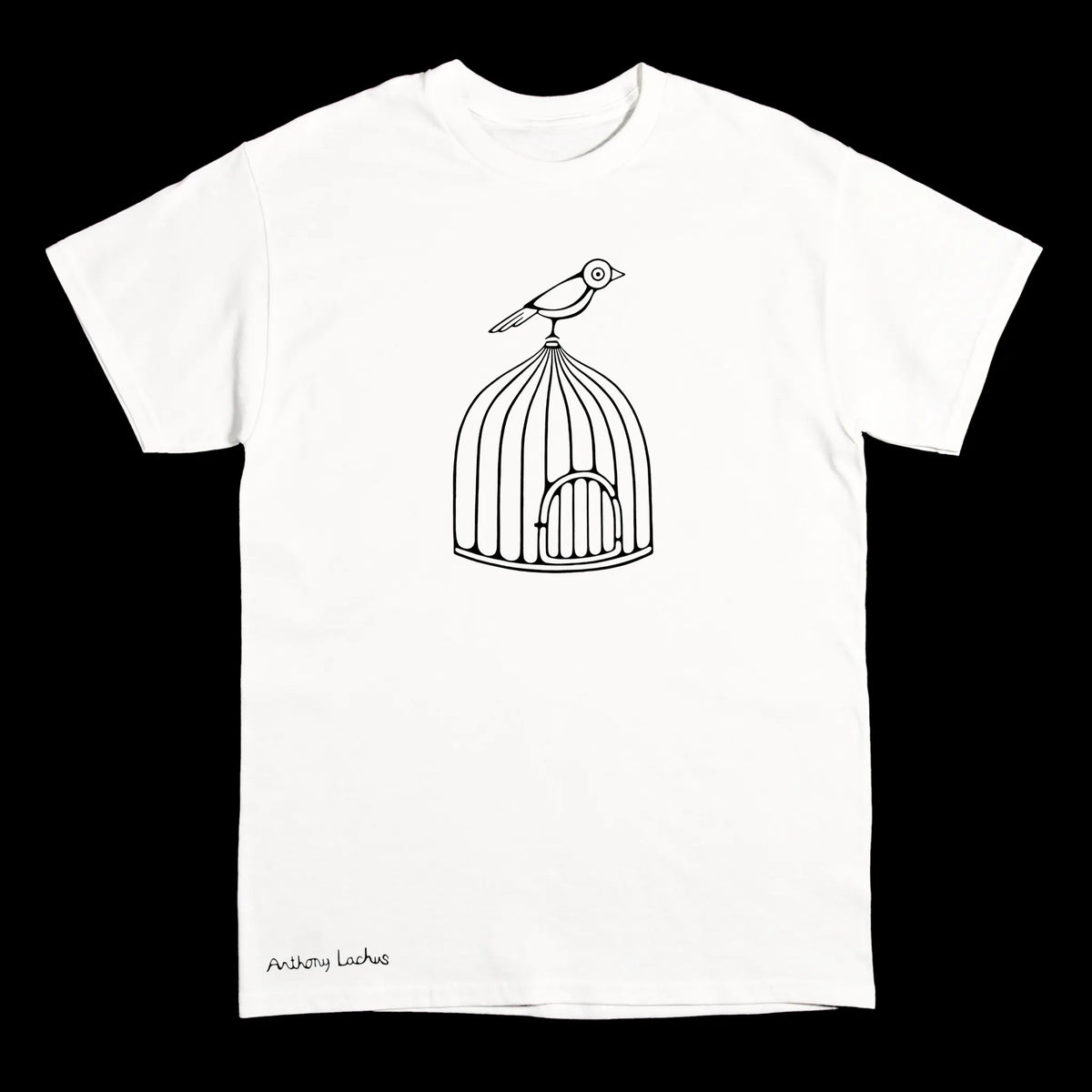 A white short-sleeve crewneck t-shirt featuring a black line art graphic of a bird perched on top of a birdcage, with the text 'Anthony Lachus' printed in black near the bottom left hem, shown against a solid black background. An original, hand drawn artwork by Anthony Lachus.