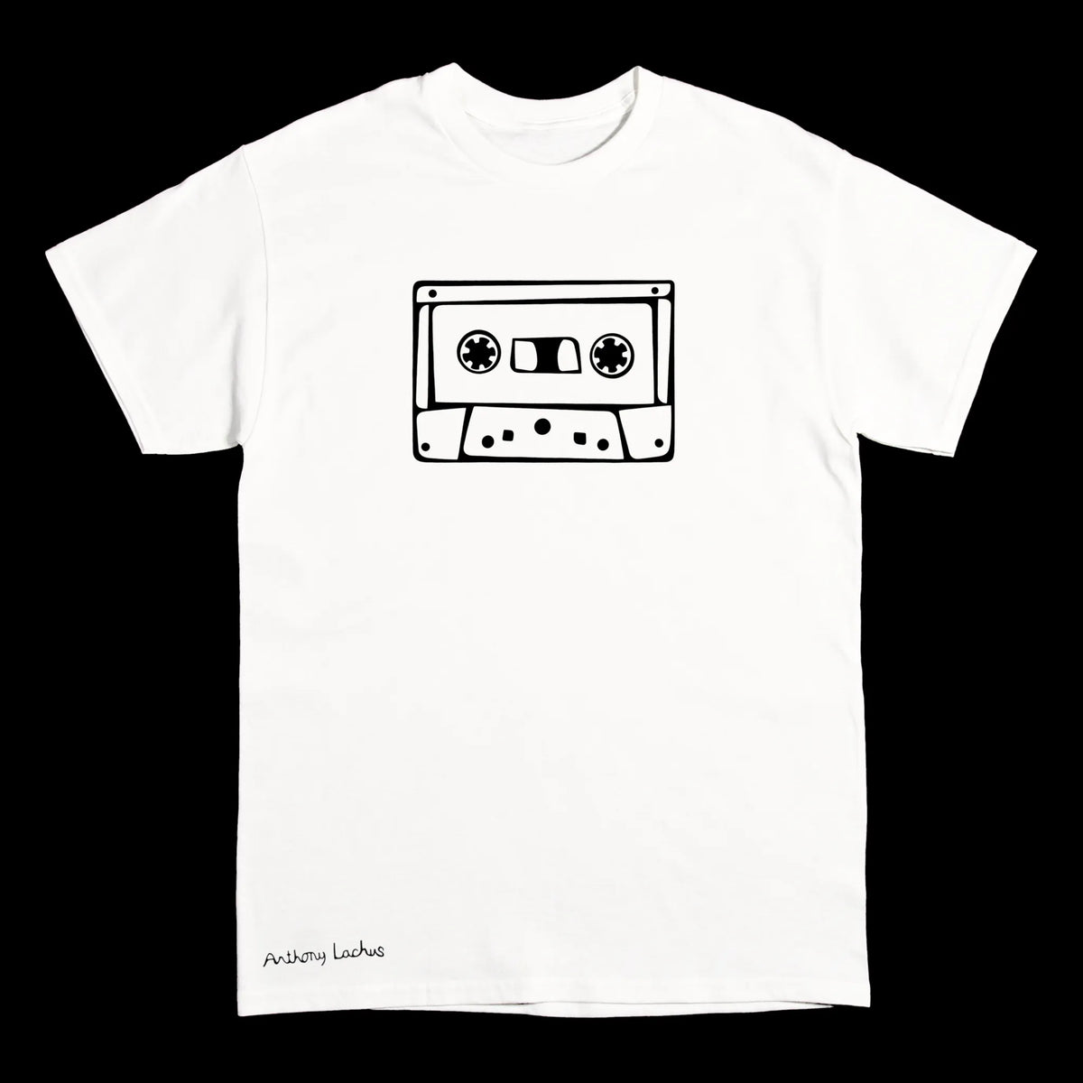 A white short-sleeve crewneck t-shirt featuring a black line art graphic of a cassette tape on the chest and the text 'Anthony Lachus' printed near the bottom left, displayed against a solid black background.