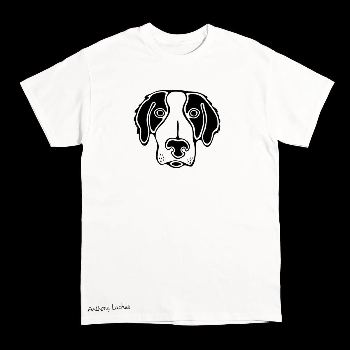 A white short-sleeve crewneck t-shirt featuring a black line art graphic of a dog's face on the chest, with 'Anthony Lachus' printed in black script near the bottom left hem, displayed against a solid black background.
