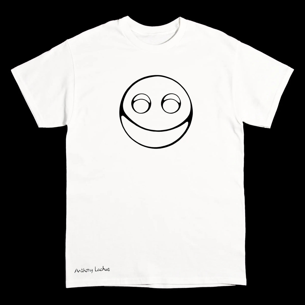A white short-sleeve crewneck t-shirt featuring a black line art graphic of a smiling face with wide eyes on the chest, and the text 'Anthony Lachus' printed in black near the bottom left hem, set against a solid black background.